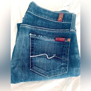 Dark wash straight leg jeans.